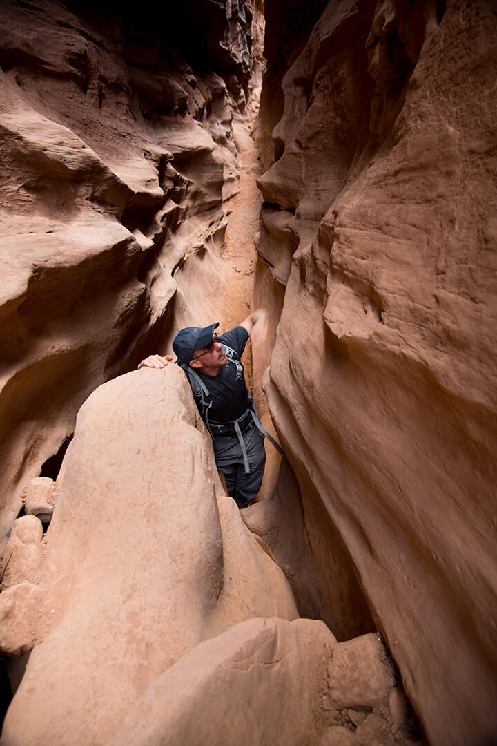 Image of the photographer Andrew Boschier in a slot canyon in Utah, USA
